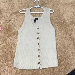 Button down sweater vest in a beige color